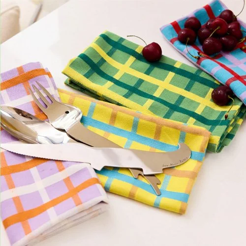 Stylish Dusen Dusen plaid napkins, durable and machine-washable, perfect for casual or festive tables.