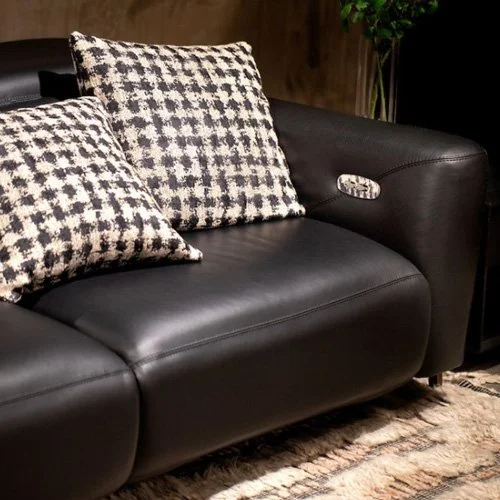 Close-up of Turin Motion Sofa’s peek-a-boo welt, double-needle top-stitch, and splayed legs in Antique Brass, Burnished Bronze, or Polished Nickel