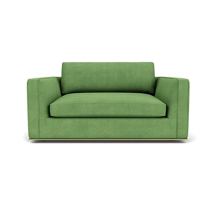 Modern sofa with refined stitching, welt trim, and customizable base finishes.