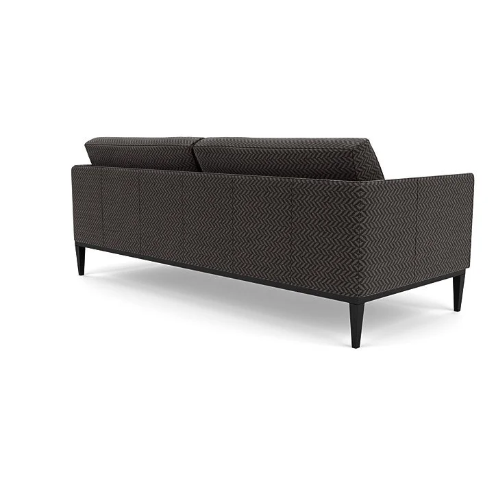 Sleek sofa with refined stitching and customizable base and upholstery.