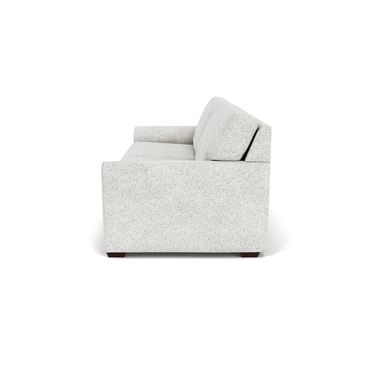 Design-forward seating with waterfall arms, plush cushions, and refined craftsmanship.