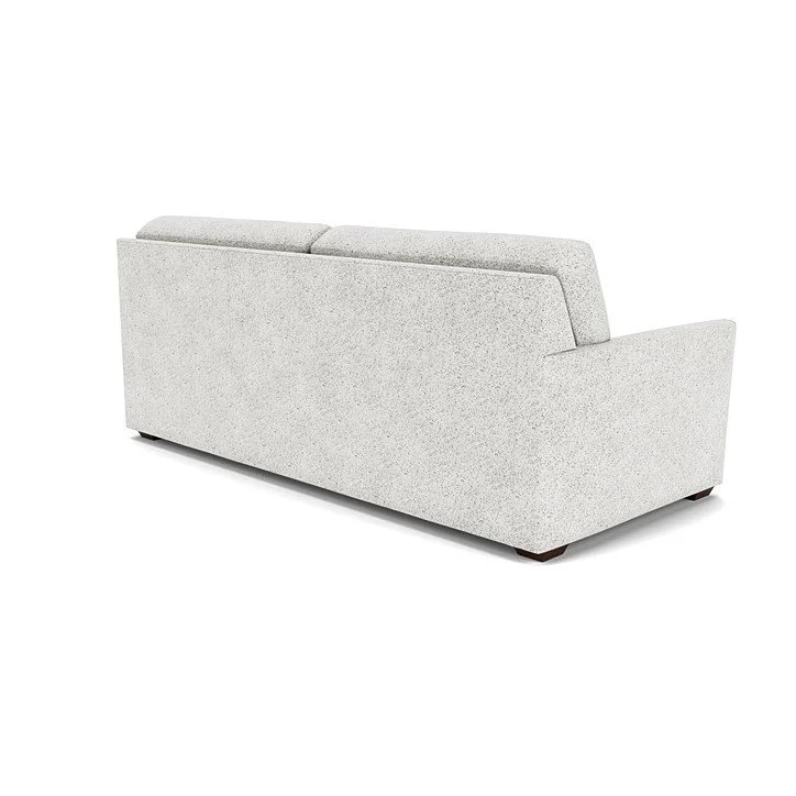 Elegant sofa with tailored stitching, relaxed cushions, and versatile customization options.