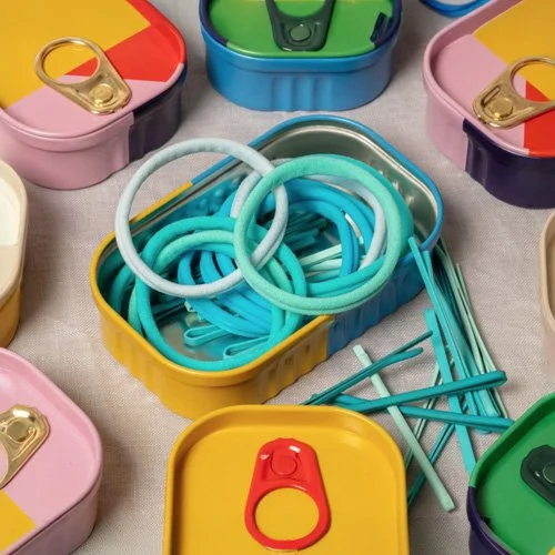 Design-led hair accessory set presented in reusable metal tin