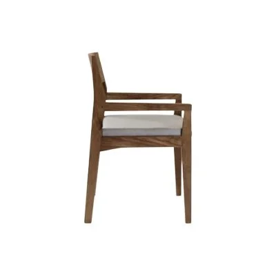 Modern walnut armchair from Copeland’s Iso Collection – eco-friendly, American-made, and crafted with heirloom quality.