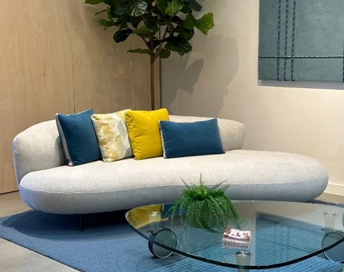 Contemporary designer sofa handcrafted in the USA with customizable finishes.