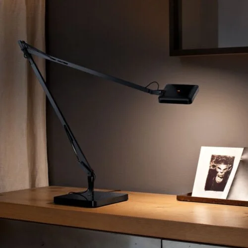 Contemporary black LED lamp offering advanced light control and refined motion.