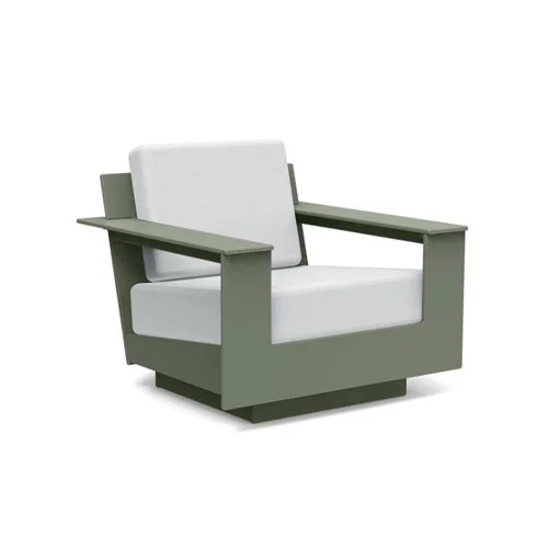 Low-slung modern outdoor lounge chair built from eco-friendly recycled plastic.