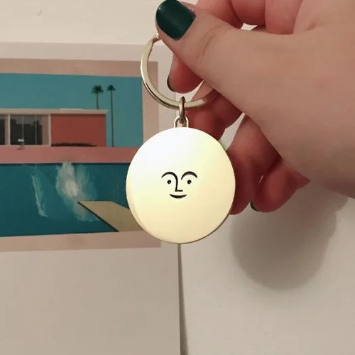 Designer key ring featuring Girard’s 1965 symbol of optimism and playful modernism.