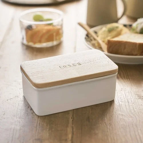 Stylish butter dish for fresh storage and refined table presentation.