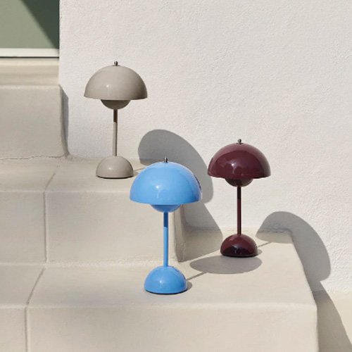 Iconic Panton lamp in vibrant red with portable modern illumination.