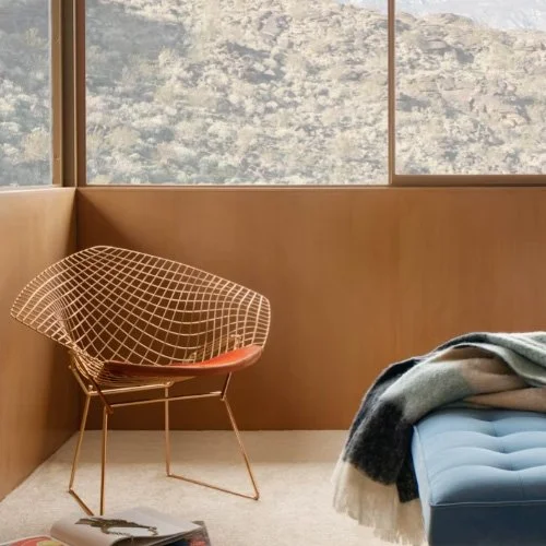 Midcentury lounge chair by Harry Bertoia with chrome finish and tailored comfort.