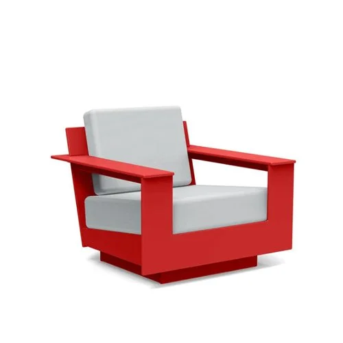 Low-slung modern outdoor lounge chair built from eco-friendly recycled plastic.