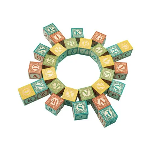 Designer educational block set emphasizing craftsmanship, learning, and modern toy aesthetics.