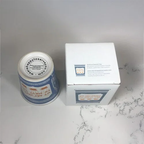 Exceptionlab We Are Happy To Serve You Mug — 10 oz ceramic version of NYC’s iconic blue-and-white coffee cup.