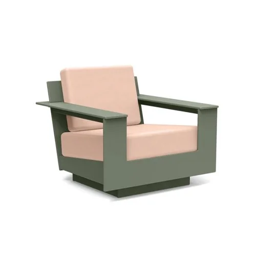Low-slung modern outdoor lounge chair built from eco-friendly recycled plastic.