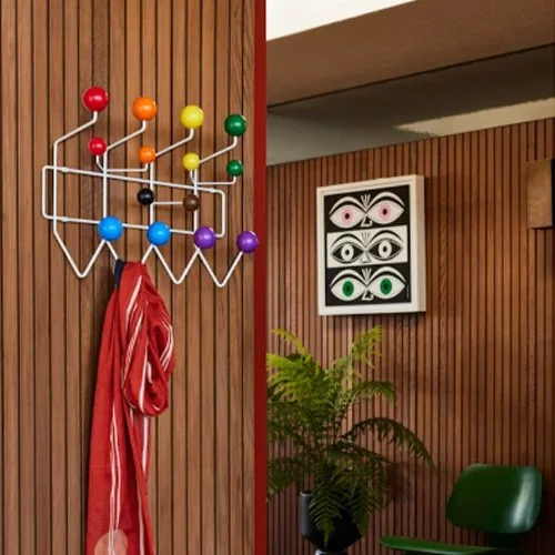 Iconic wall-mounted rack by Charles and Ray Eames in bold, colorful finishes.