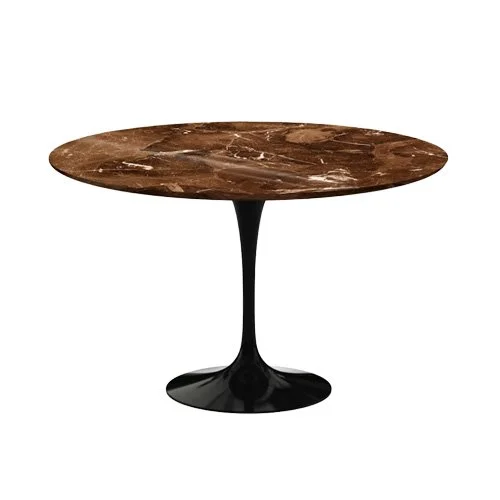 Midcentury round marble table designed by Eero Saarinen with bright white cast base.