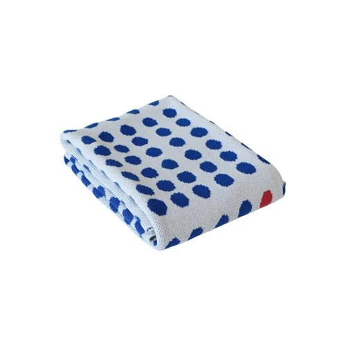 Soft, all-season recycled cotton blanket blending form, color, and simplicity.