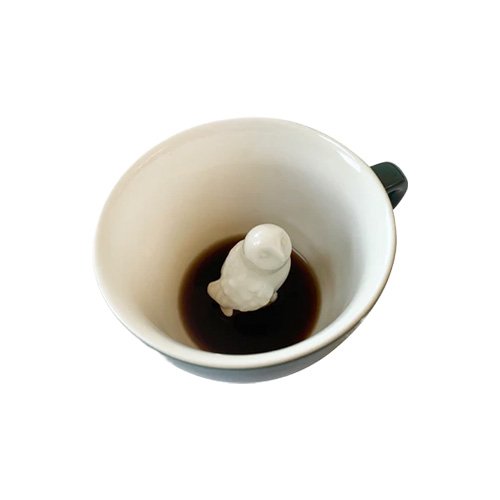 Creature Cups Owl Mug in emerald green with hidden owl figure inside.