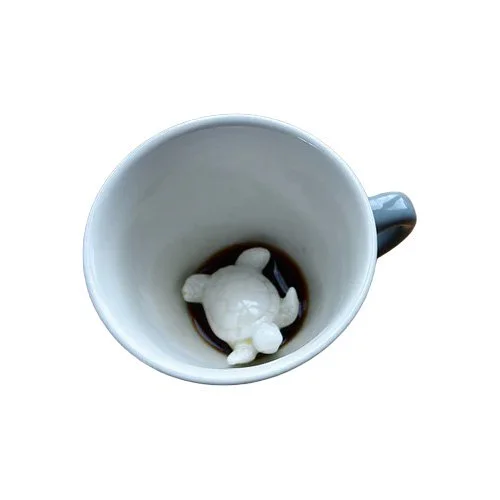 White ceramic Turtle Coffee Cup by Creature Cups with hidden turtle inside.