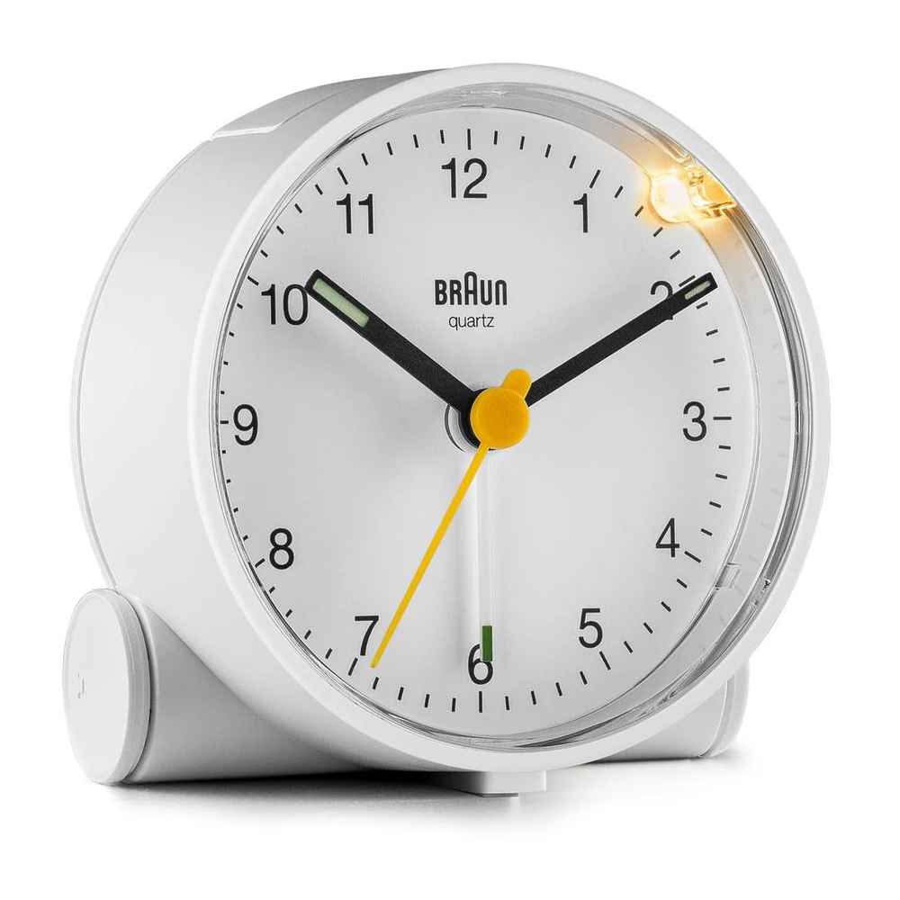 White bedside clock featuring quiet quartz, luminous hands, and integrated snooze/light for clarity