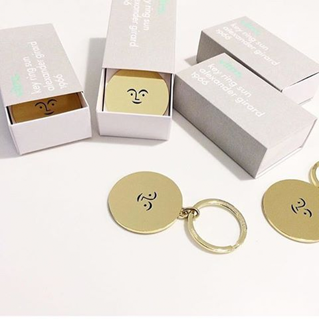 Collectible brass keychain blending midcentury modern design with everyday function.