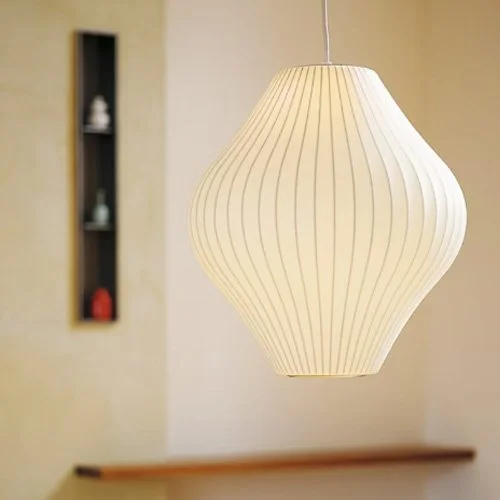 Midcentury pendant by George Nelson with translucent polymer and steel frame.