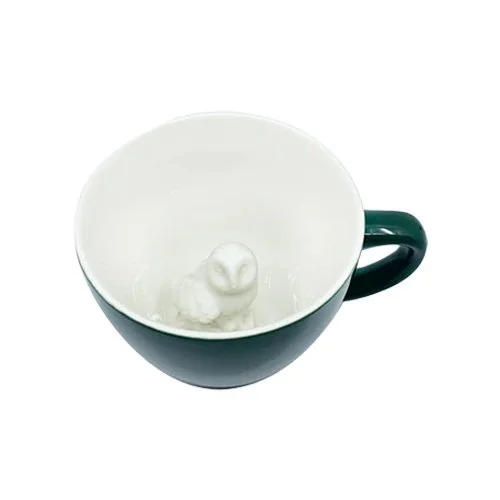 High-fire ceramic coffee cup with sculpted owl at the bottom.