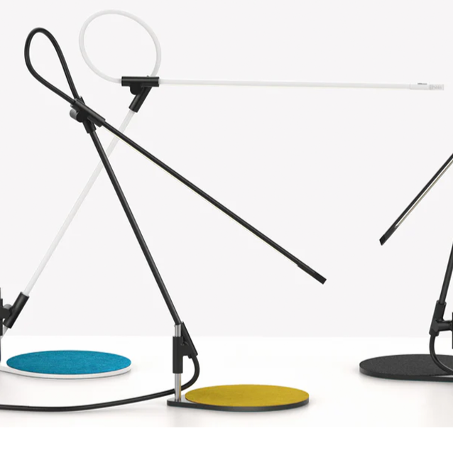 White articulated LED desk lamp with refined movement and precise illumination.