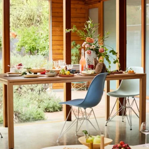 Sculptural dining chair by Herman Miller in subtle pale blue finish.