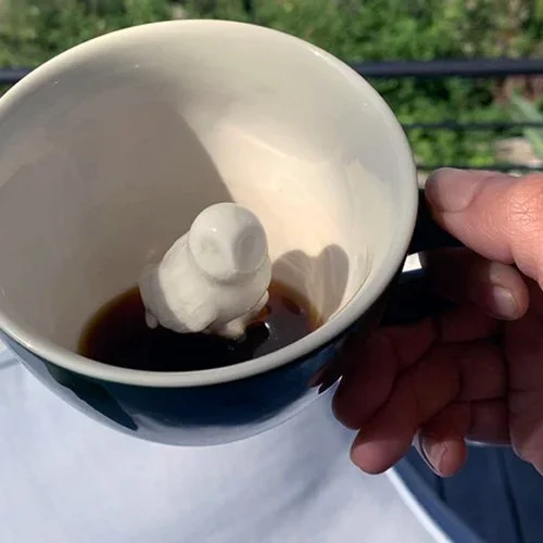 Creature Cups Owl Mug in emerald green with hidden owl figure inside.