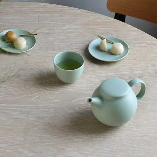 Pebble Teapot by Kinto with smooth porcelain finish and built-in strainer, designed for modern tea rituals. (Copy) (Copy)