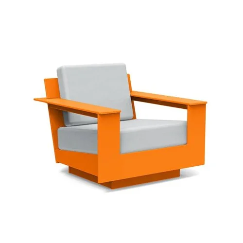 Low-slung modern outdoor lounge chair built from eco-friendly recycled plastic.