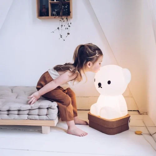 Compact bear-shaped polyethylene lamp providing warm ambient glow.