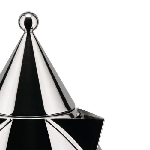 Iconic Alessi kettle blending architectural form with everyday function.