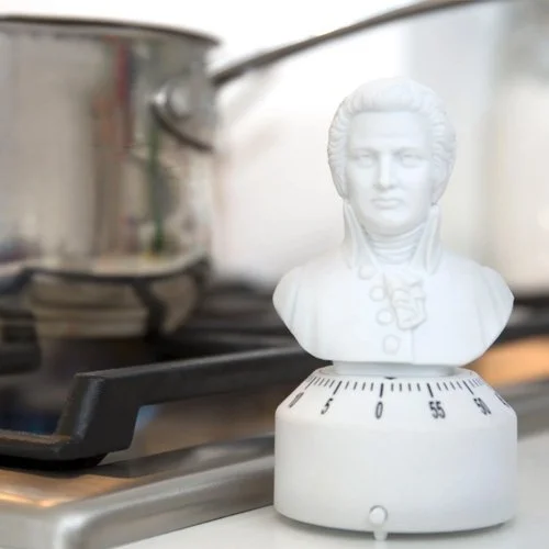 Whimsical Mozart timer offering creative kitchen style with wind-up precision