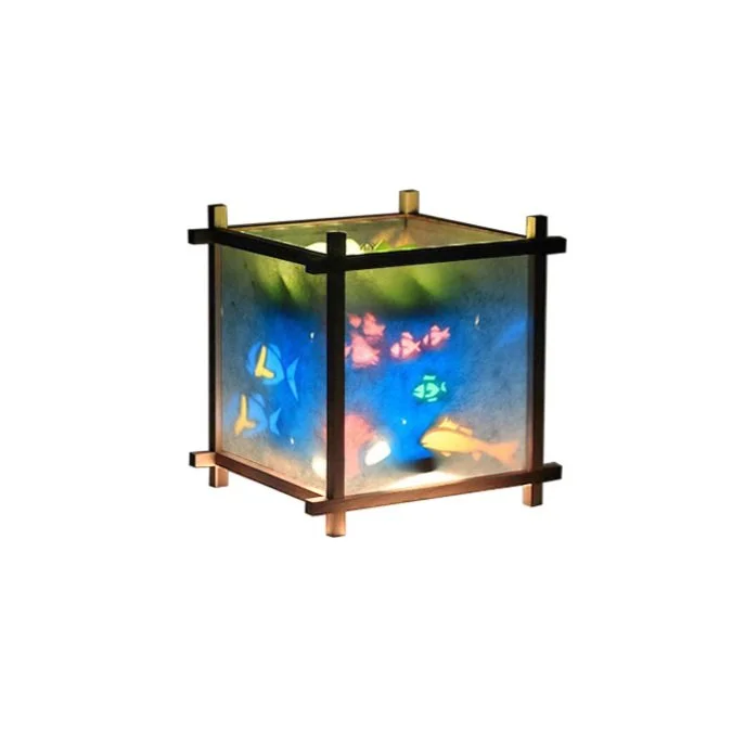 Cedar-framed rotating lamp with tropical fish silhouettes in rice paper.
