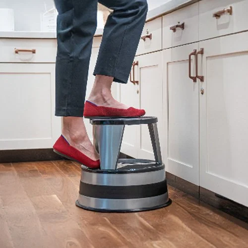 Classic industrial rolling stool offering safety and minimalist style.