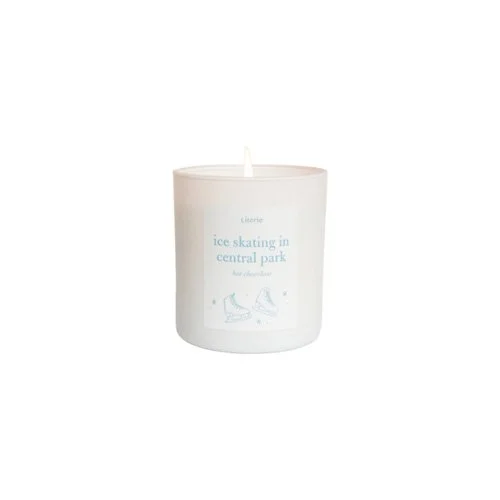 Literie Ice Skating in Central Park candle with pine, juniper, and citrus notes.