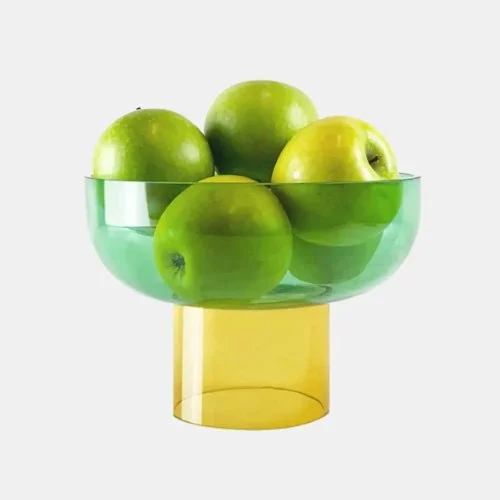 Handcrafted green and yellow glass bowl by Cloudnola—vibrant and sculptural accent for modern interiors.