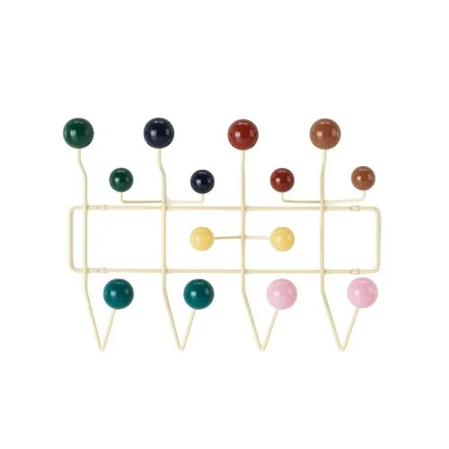 Iconic wall-mounted rack with colorful hooks and modern geometry.