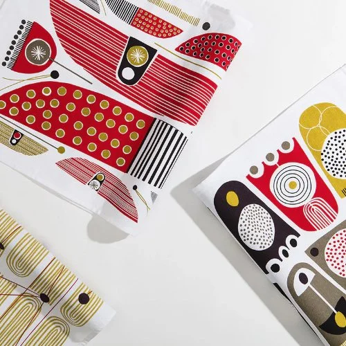 Graphic cotton kitchen towel featuring playful matchstick design