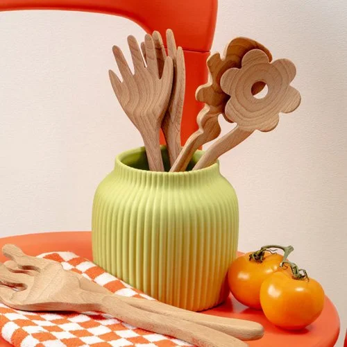 Beechwood service utensils with graphic modern appeal for curated interiors and design-forward homes.