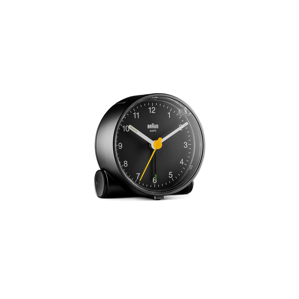 Braun BC01 black alarm clock with clean dial, yellow second hand, and minimalist case.