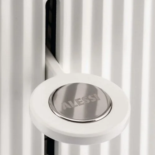 Modern Alessi kitchen appliance featuring reheat and defrost settings.