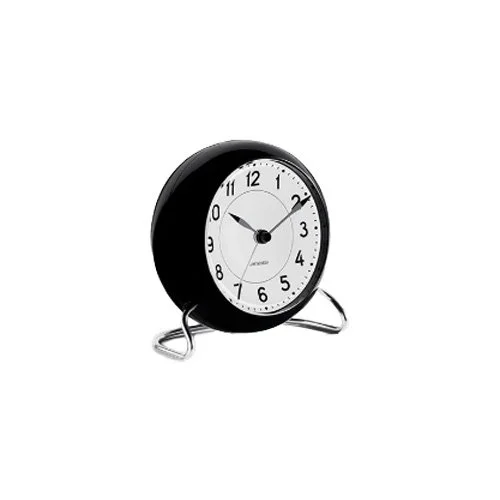 Analog alarm clock with snooze function, light sensor, and distinctive Station dial.