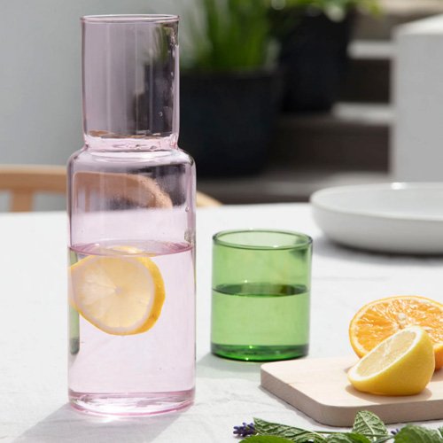Modern color block glass carafe with playful sculptural form.
