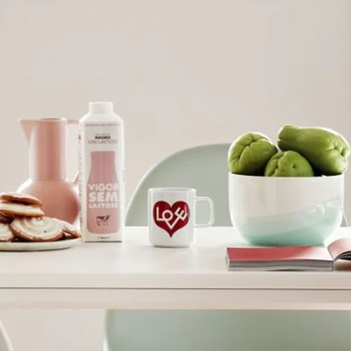 Designer porcelain mug featuring Girard’s 1961 Love Heart symbol in striking crimson.