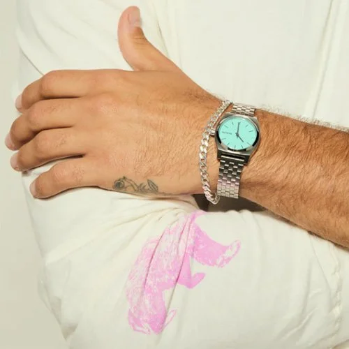 Nixon Medium Time Teller watch in silver and turquoise with stainless steel bracelet
