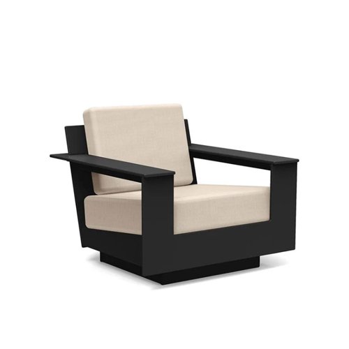 Low-slung modern outdoor lounge chair built from eco-friendly recycled plastic.